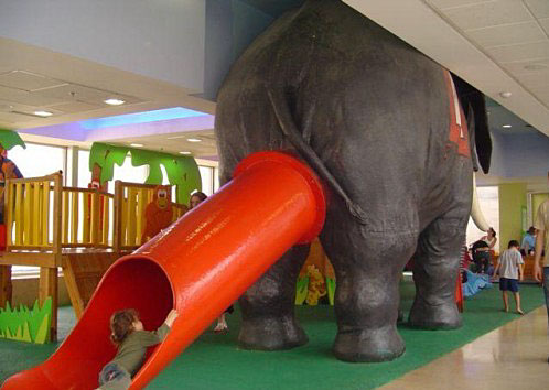 Slide coming out of a large elephants rear end